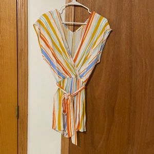 White with colored stripes romper and has pockets
